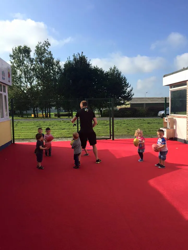 Pre-schoolers playing rugby with Rugbees